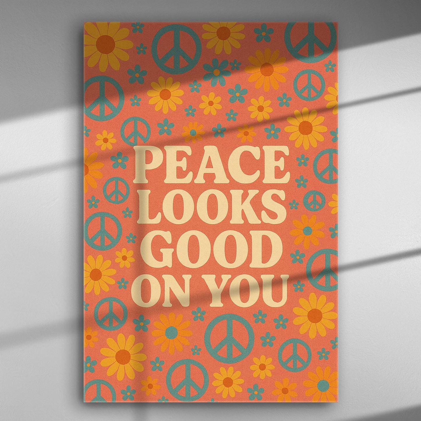 Canvas print with peace symbols and flowers on an orange background with the message 'Peace Looks Good On You'.