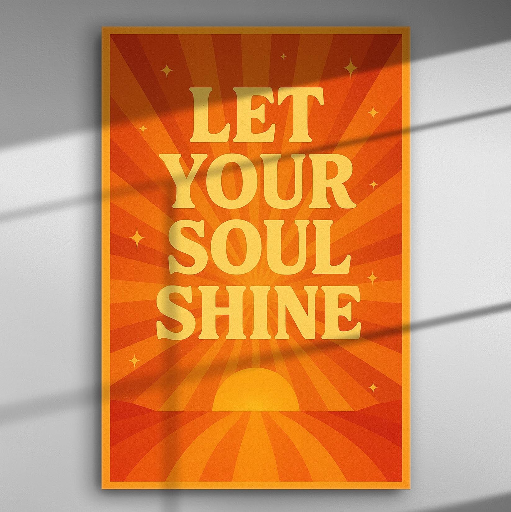 Orange and yellow poster with the inspirational phrase 'Let Your Soul Shine', featuring sun rays and stars.