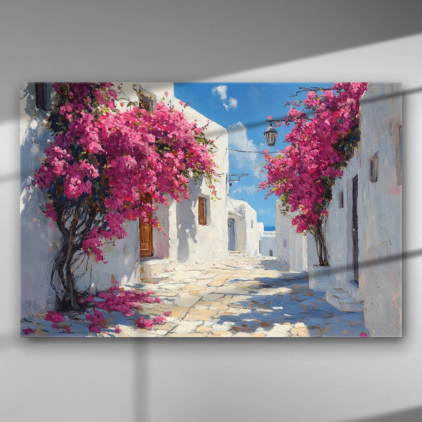 Canvas print of a Greek alley with blooming bougainvillea and white houses.