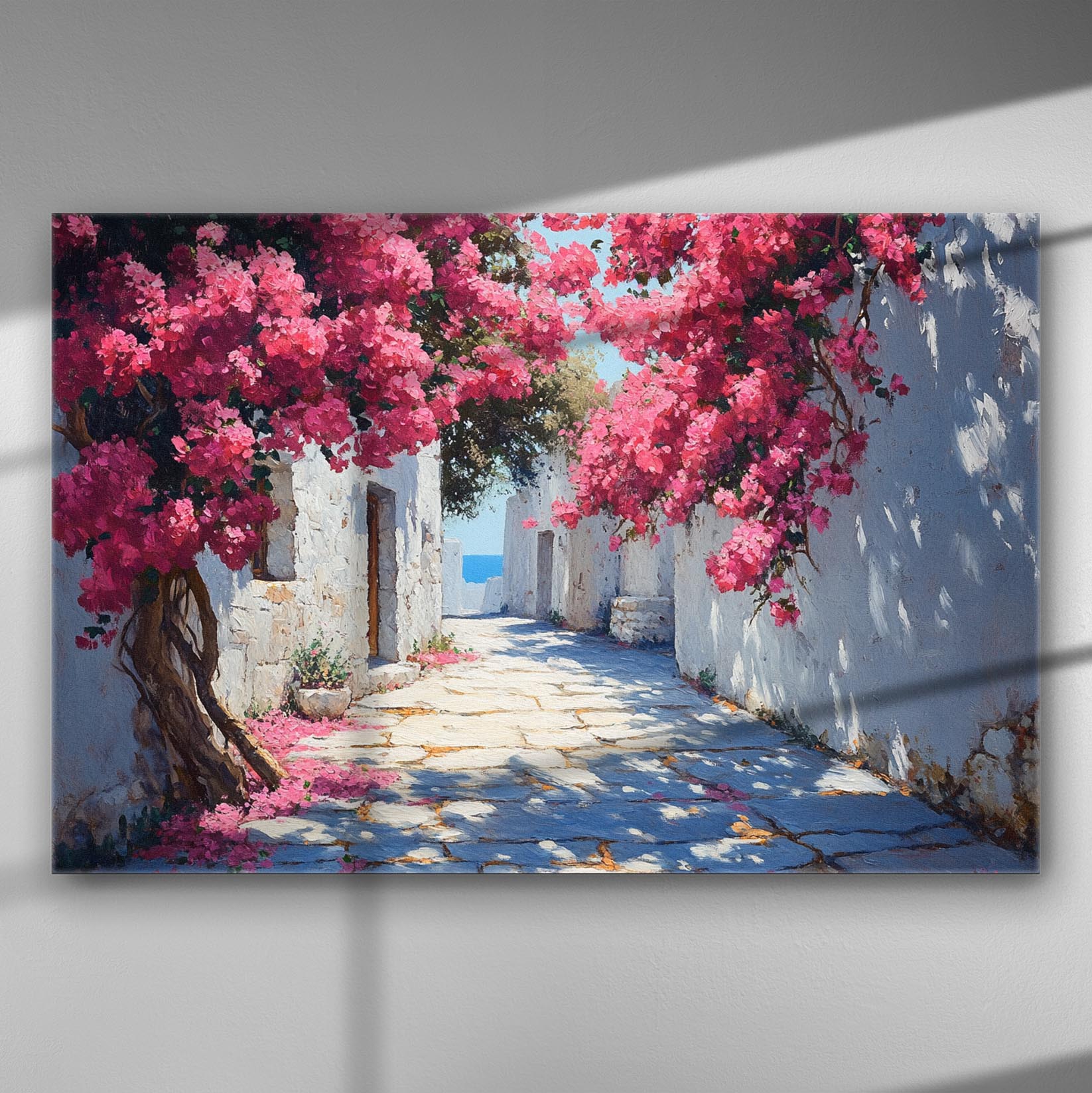 Charming Mediterranean alley with pink bougainvilleas and white stone walls.