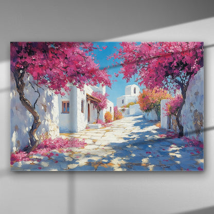 Canvas print showing a Greek island street with white houses and blooming pink bougainvillea.