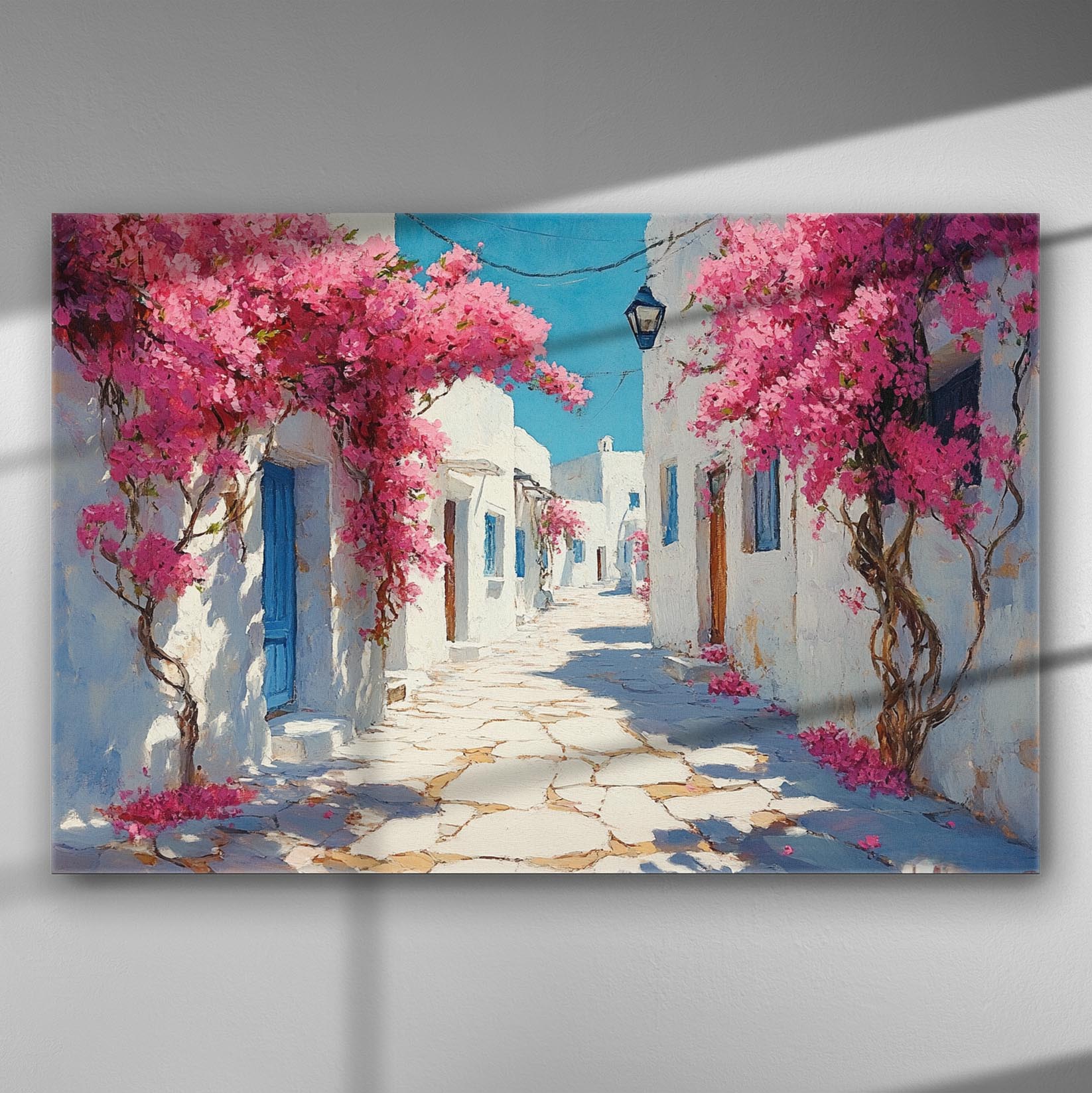 Canvas print of a summer street scene with pink bougainvillea and white buildings.
