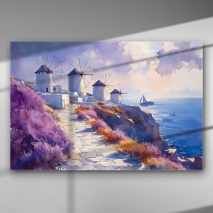 Aegean windmills by the sea with purple flowers and a sailboat in the distance.