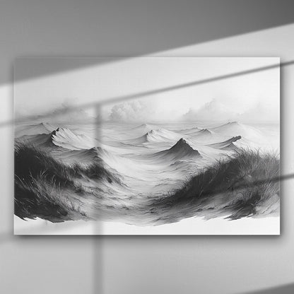Black and white canvas art depicting ocean waves and dunes under a cloudy sky.
