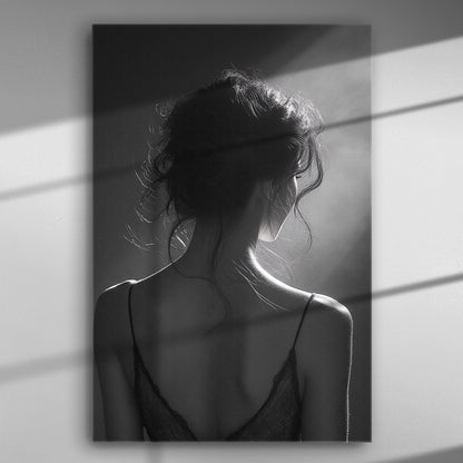 Black and white image of a woman's silhouette with back light and shadows.