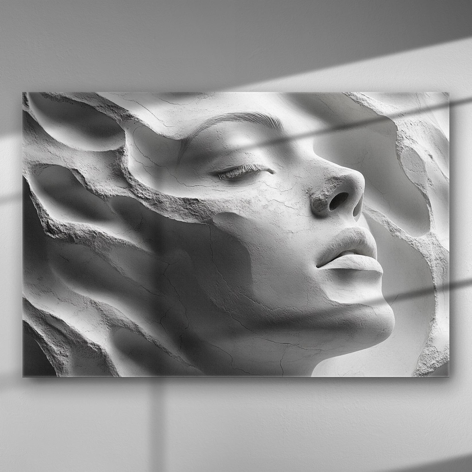 A sculptural profile of a woman's face in high detail, casting soft shadows on a canvas.