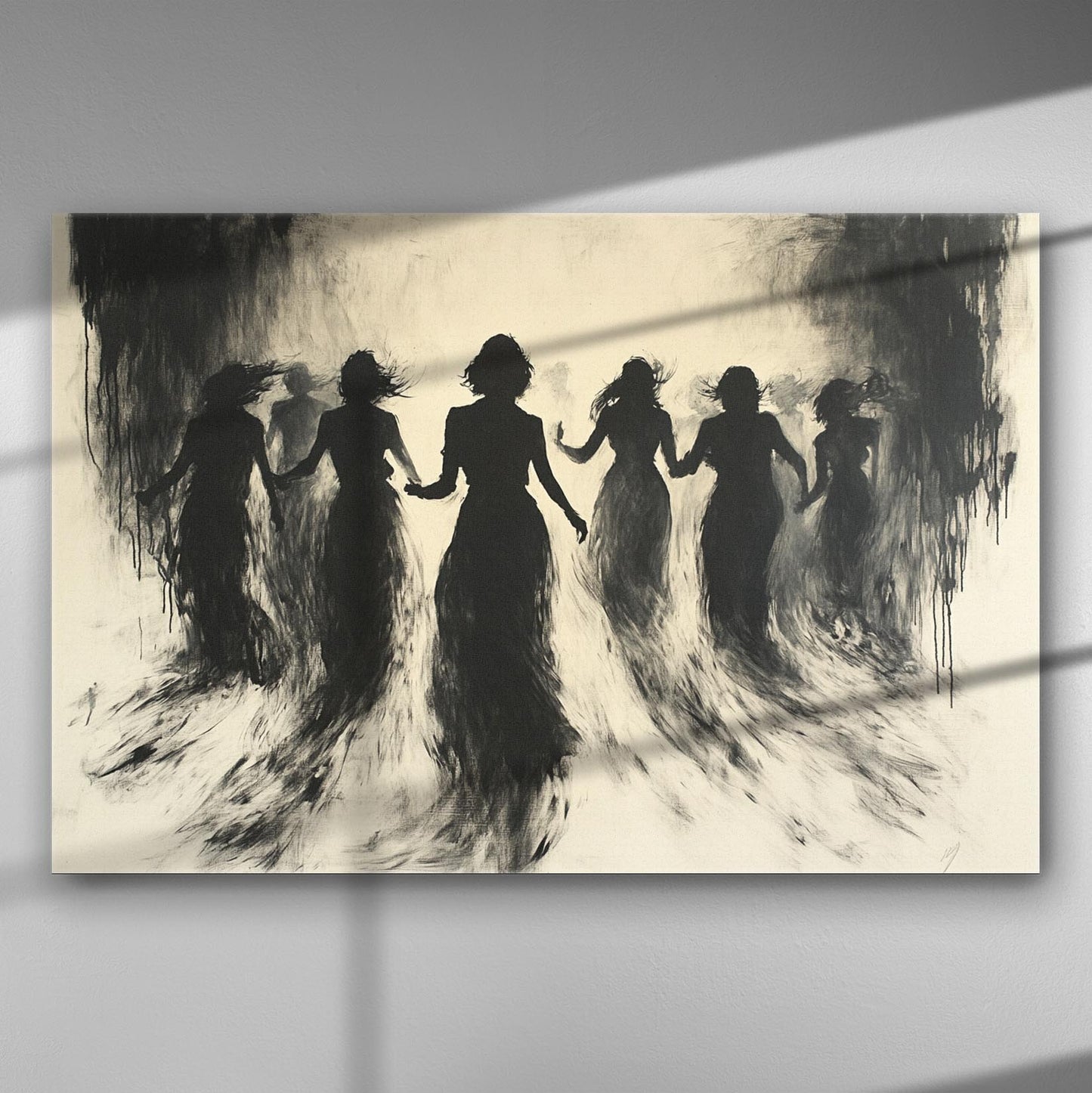 Silhouettes of women dancing, creating a mysterious and etheral scene in black and white.