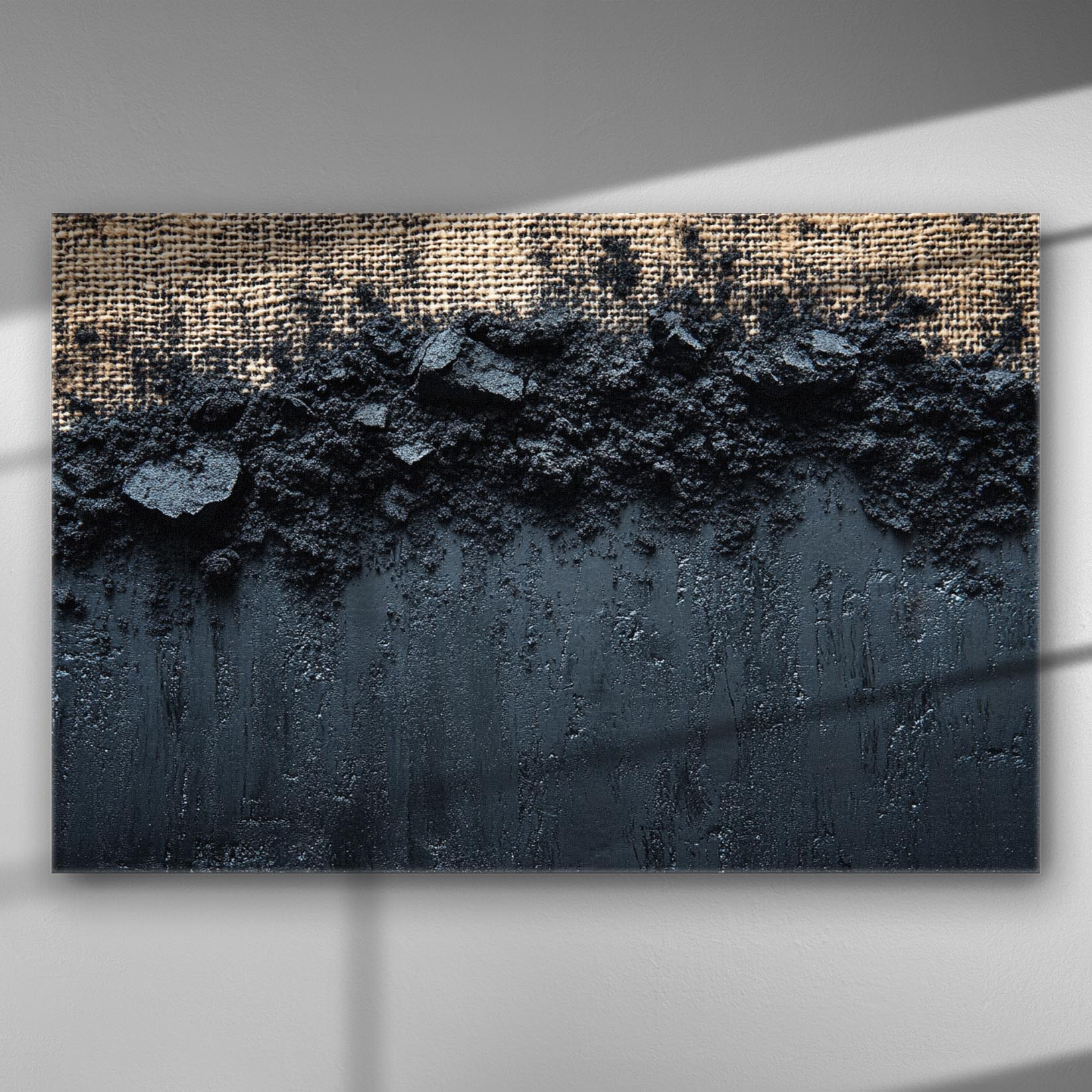 Abstract dusty landscape texture with black hues and intricate details on canvas.