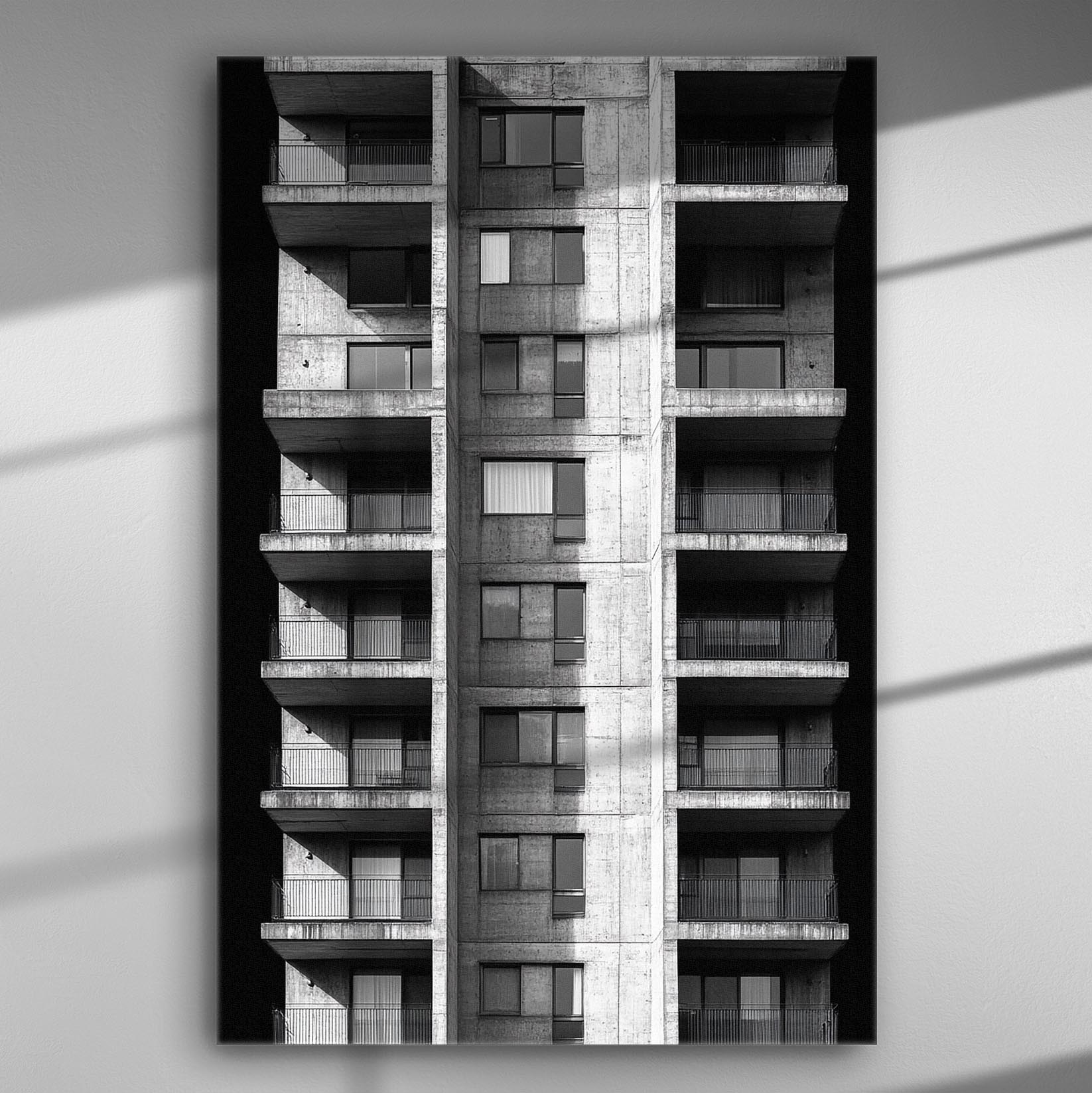 Black and white photograph of a modern residential building facade.