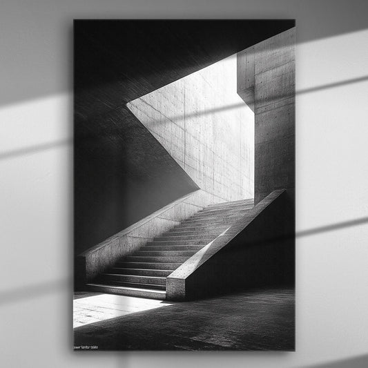Black and white architectural photograph of a modern staircase illuminated by natural light.