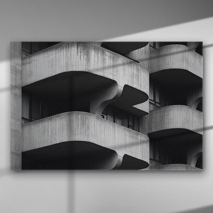 Black and white geometric architectural image with curved concrete balconies creating a bold pattern.