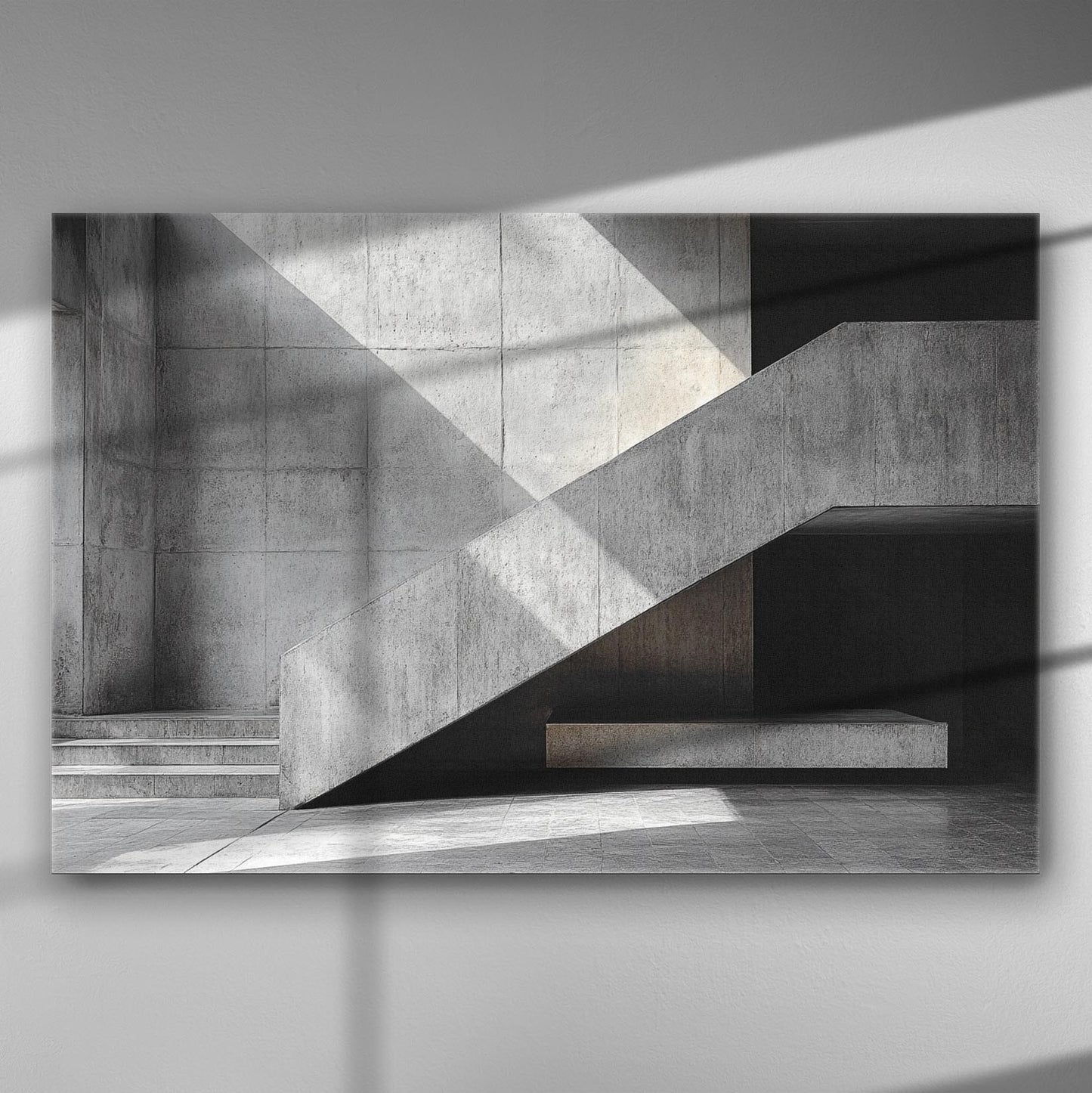 Black and white geometric architectural lines with shadows on a concrete wall.