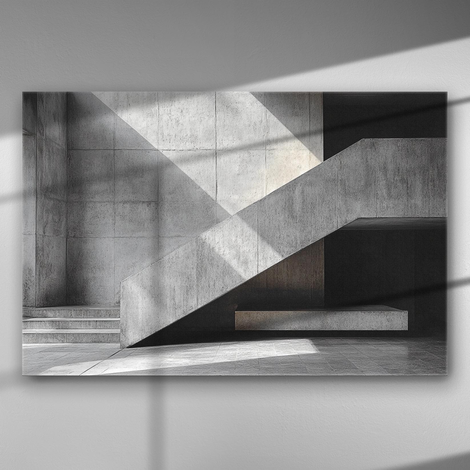 Black and white geometric architectural lines with shadows on a concrete wall.