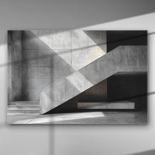 Black and white geometric architectural lines with shadows on a concrete wall.