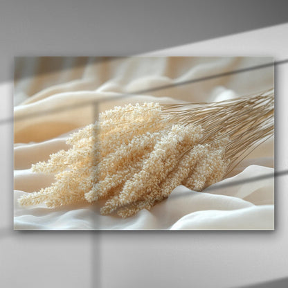 Canvas print of delicate white dried flowers on soft fabric, creating a serene and calming composition.