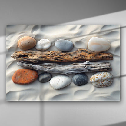 Canvas print featuring stones and driftwood on sand, evoking tranquility and balance.