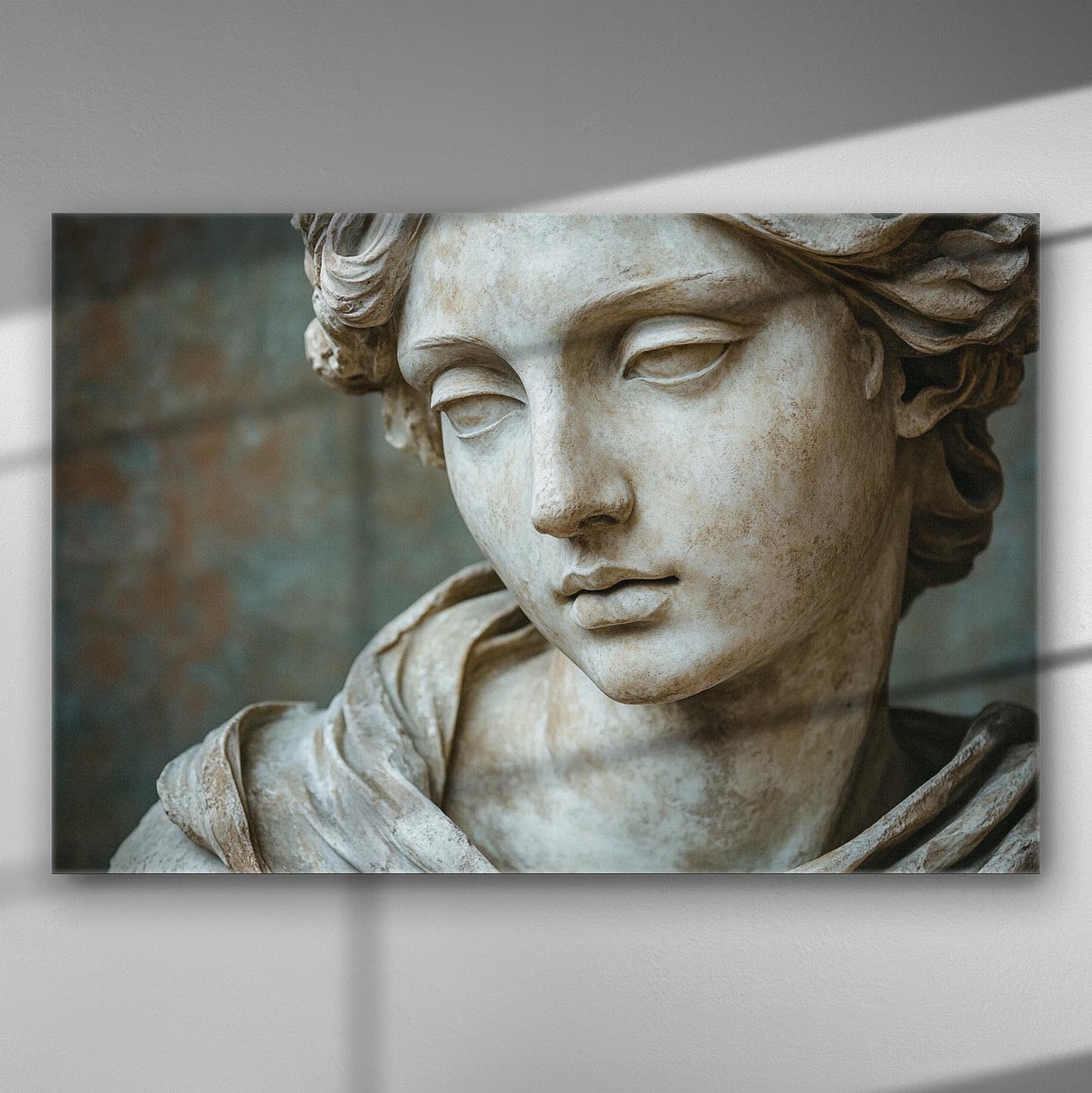 Close-up of a classical Greek sculpture's face on a canvas print, highlighting serene beauty and detailed artistry.