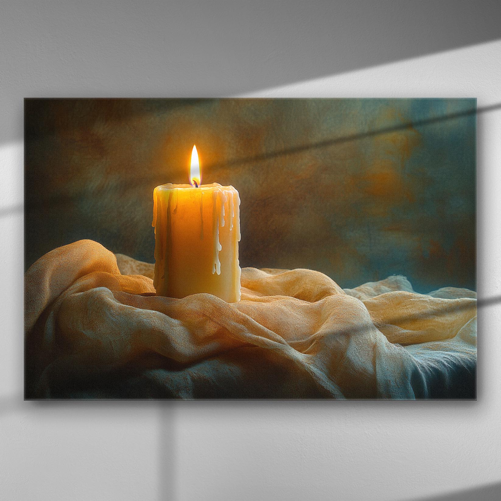 A candle on a cloth with a soft glowing light creating a serene atmosphere.