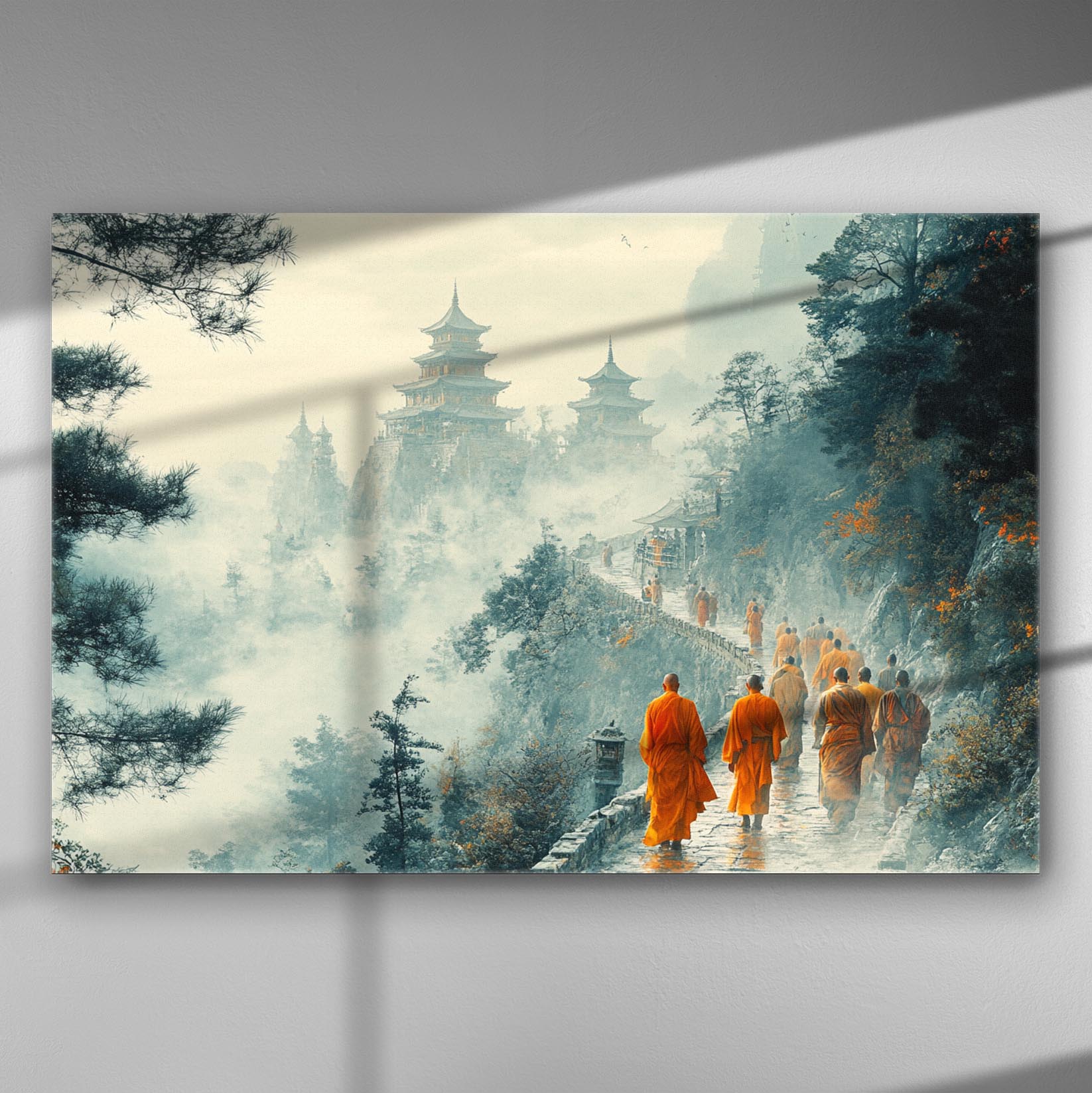 Scenic view of foggy mountains with temples and monks in orange robes walking along a path.