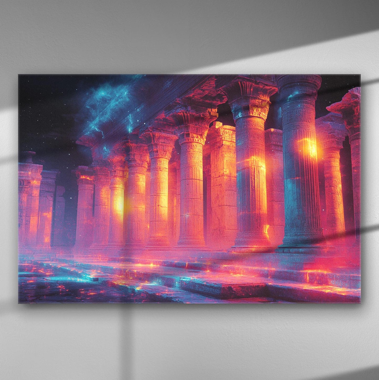 Canvas print of an ancient temple illuminated by vibrant lights in orange and purple hues.