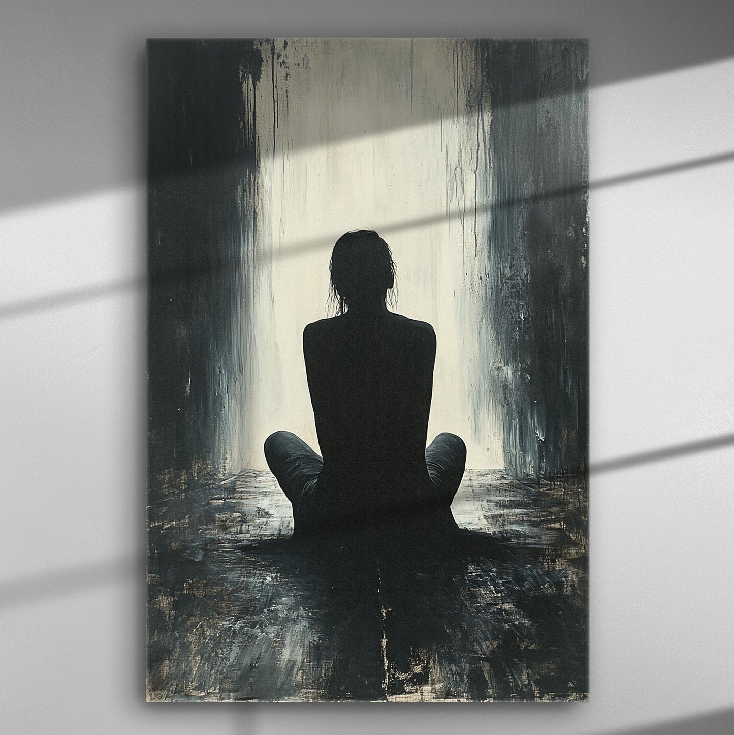 A silhouette of a person sitting in a dimly lit room with a bright light in the background, creating a striking contrast in black and white tones.