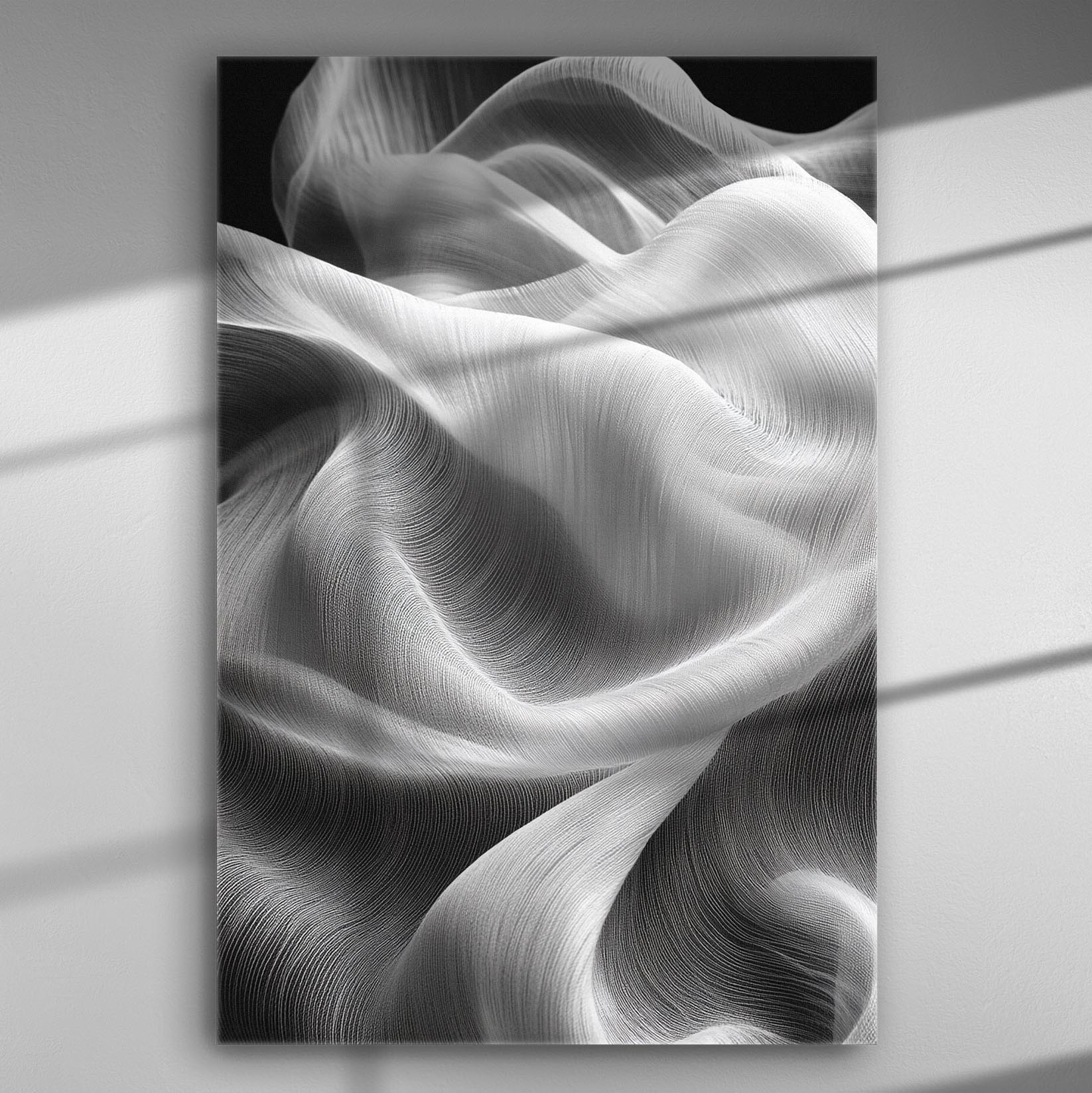 Flowing white fabric creating wave-like patterns in black and white canvas art.