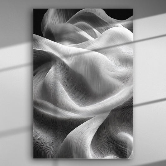 Flowing white fabric creating wave-like patterns in black and white canvas art.
