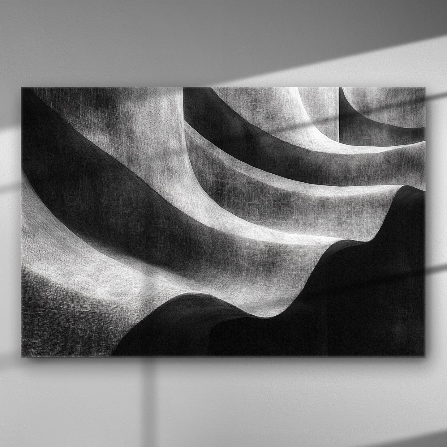 Abstract black and white canvas with wave-like patterns and shadows.