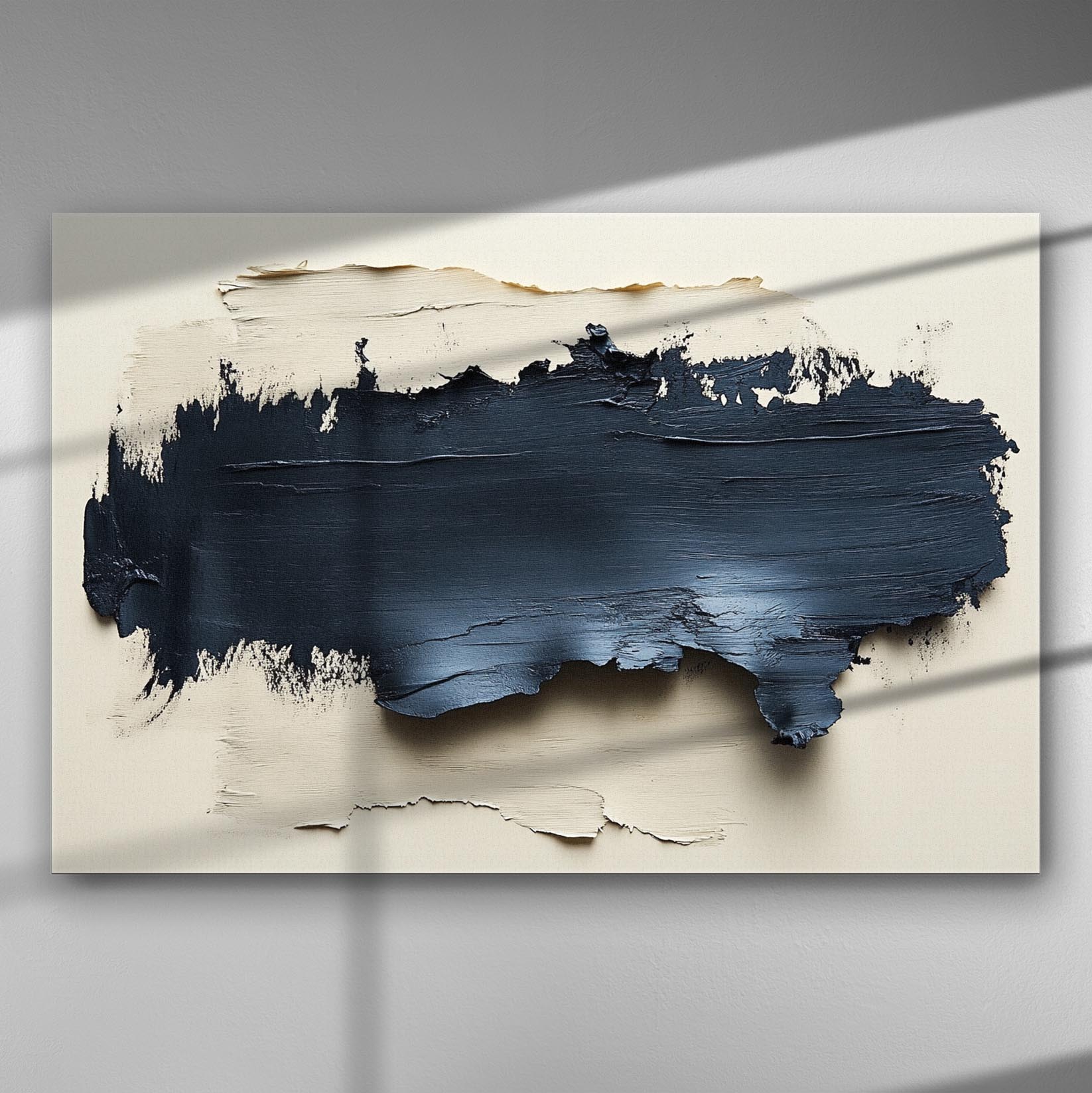 Abstract canvas art with thick black and navy texture against a light background.