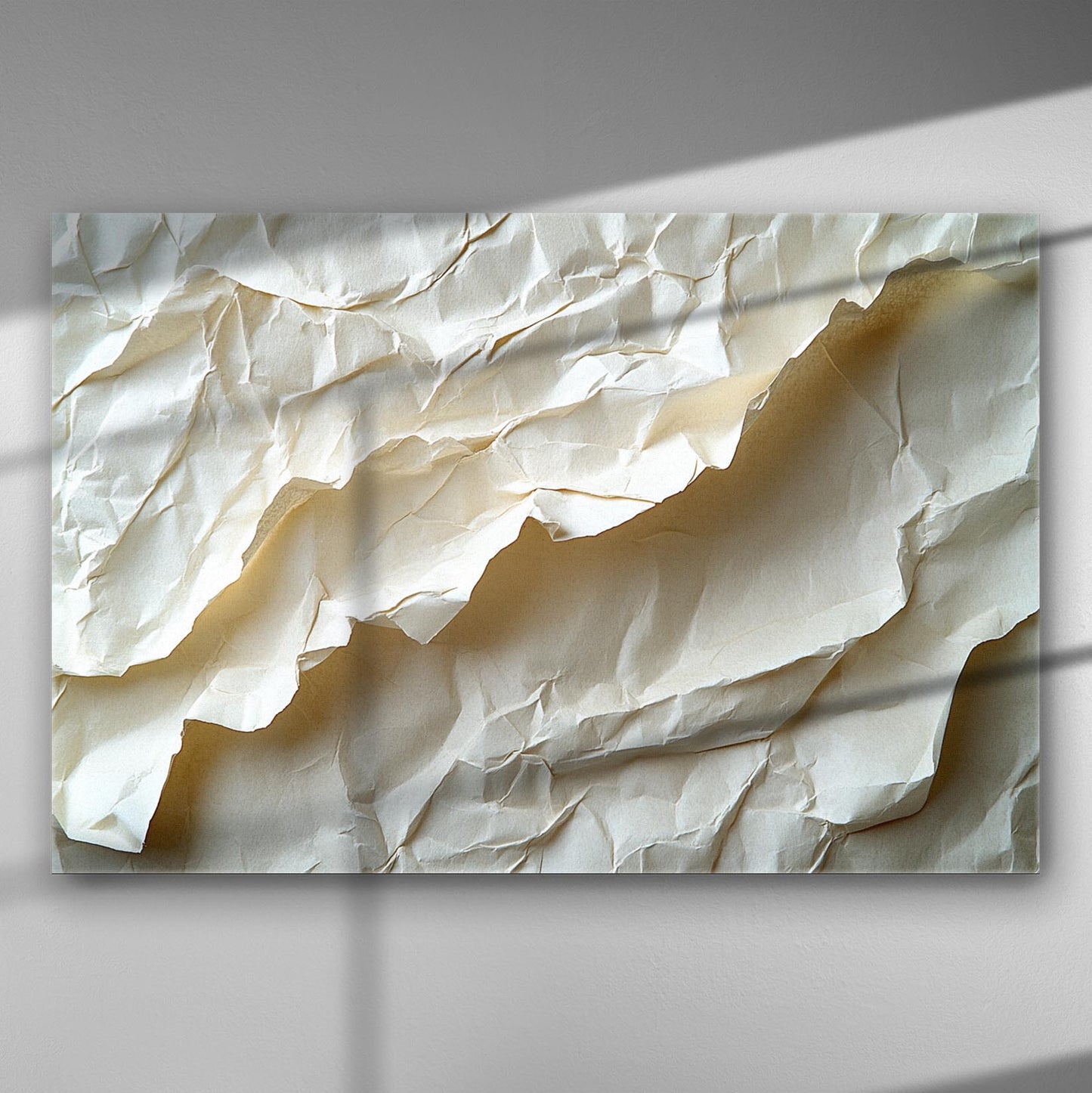 Artwork featuring a wrinkled paper texture with shadows and light adorns the canvas.