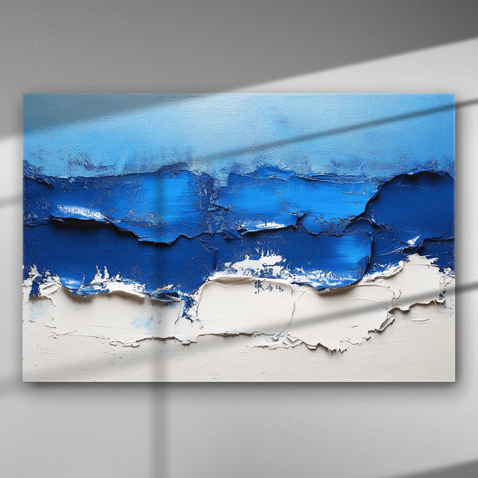 Abstract seascape painting with blue waves and white sandy texture on canvas.
