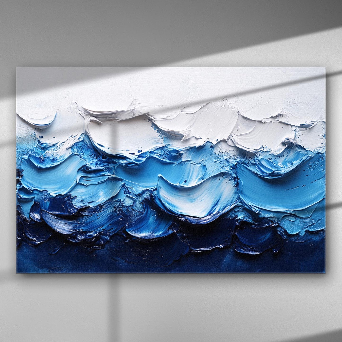 Abstract waves in white and blue hues on a canvas painting.