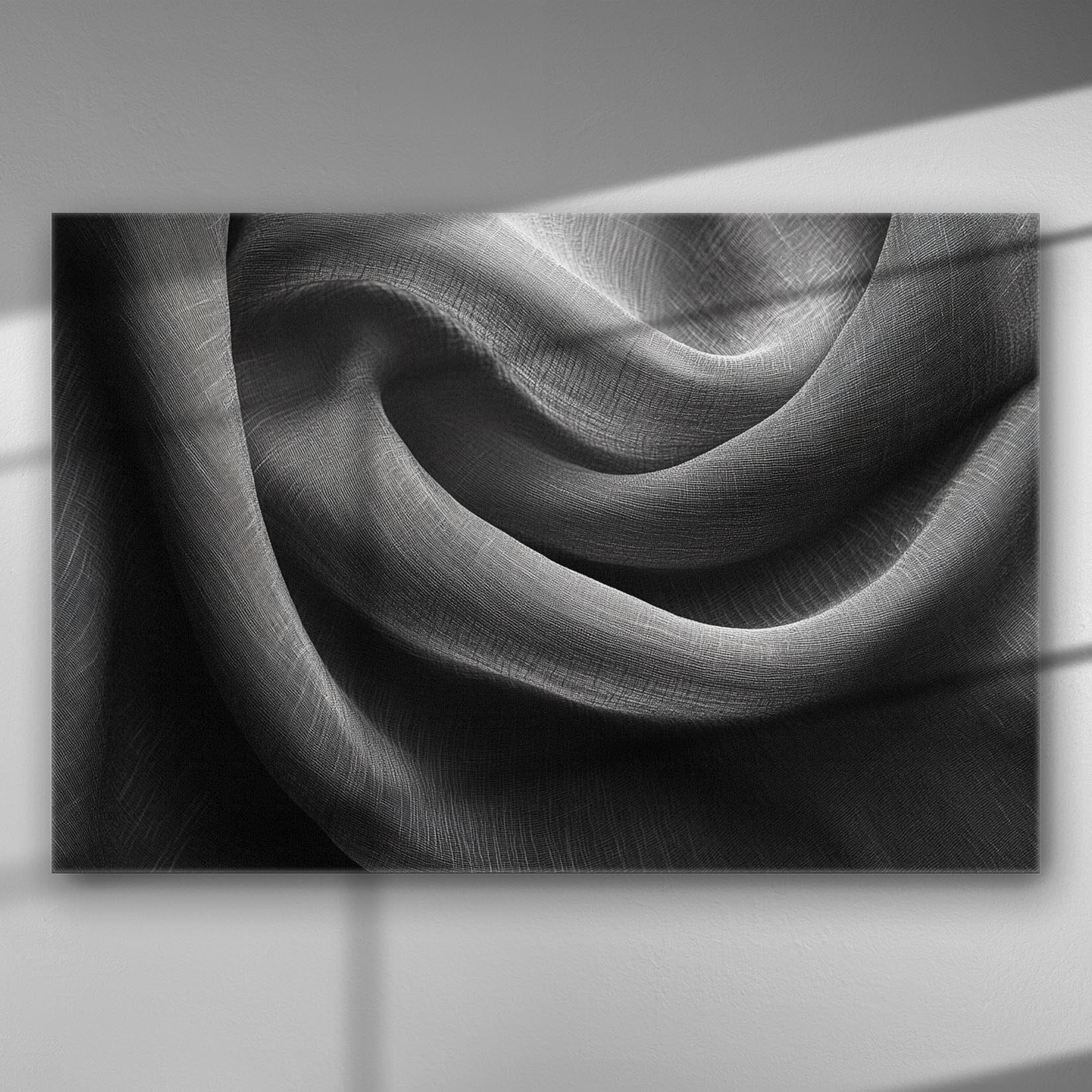 Black and white abstract of flowing fabric on canvas.