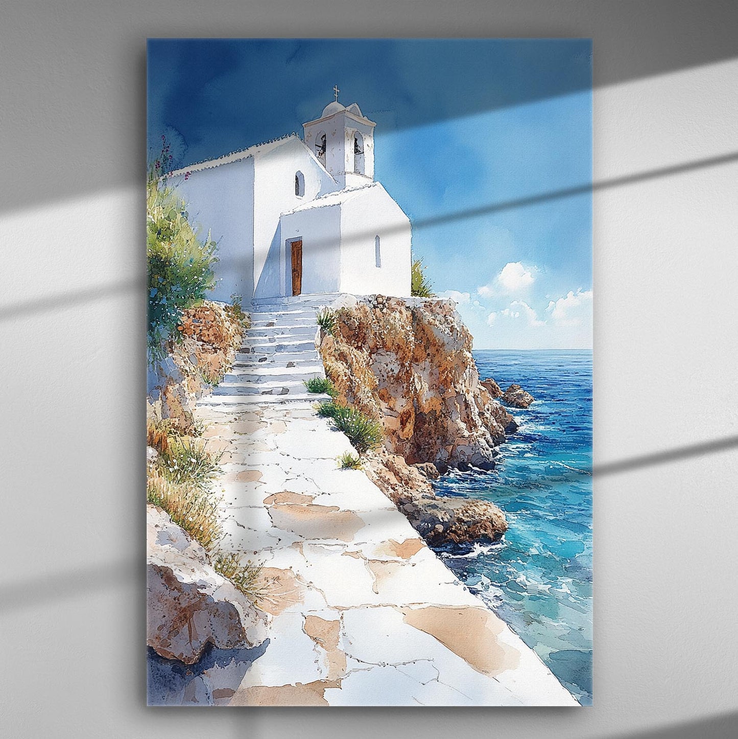 White chapel on a cliff by the sea with clear blue sky