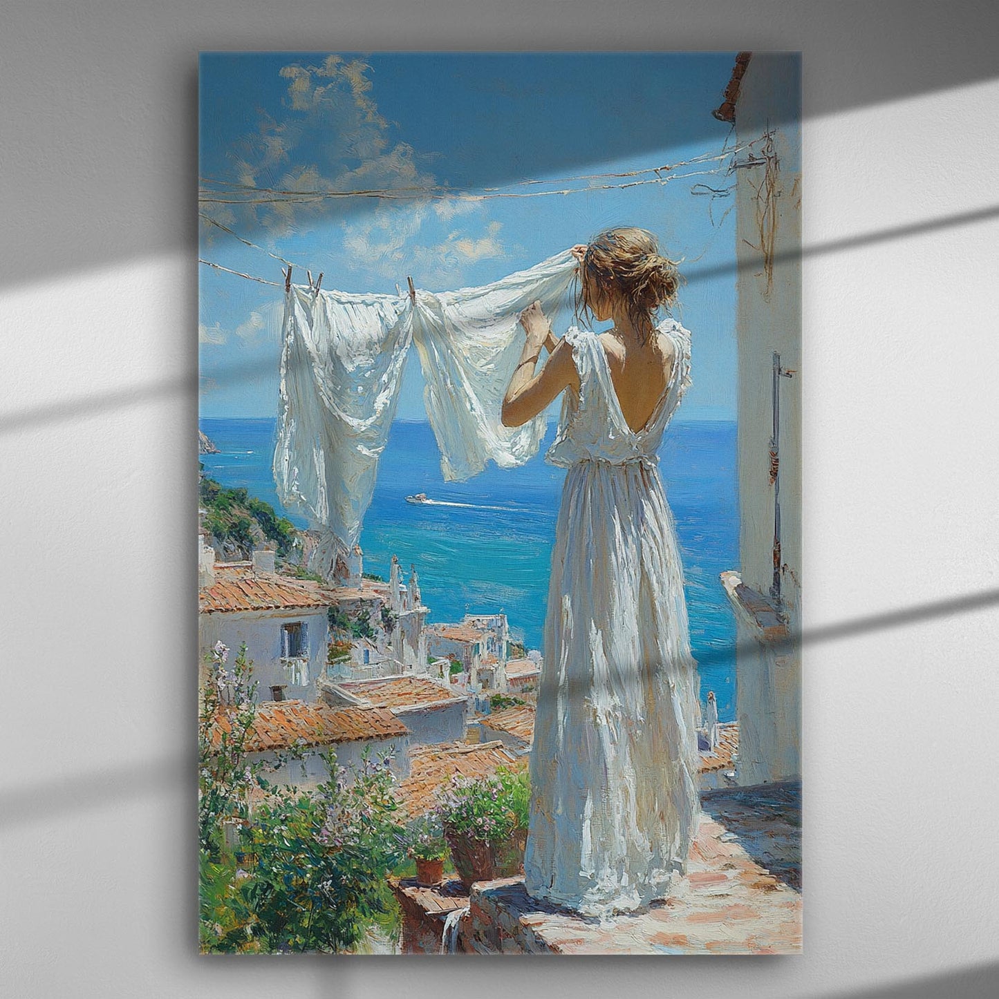 A woman hanging white linens with a seaside view in the background on a canvas print.