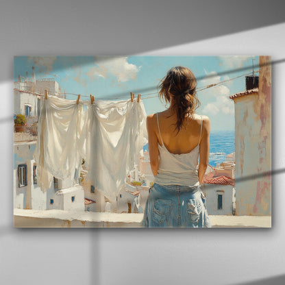 A woman looking over a Mediterranean sea view with white cloths hanging in the foreground.