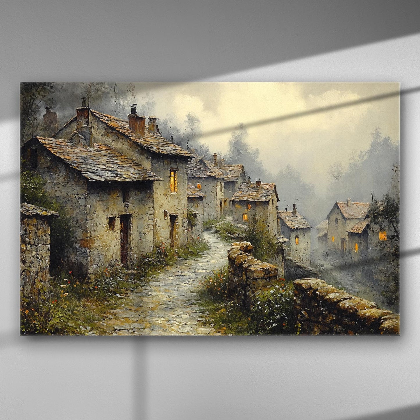 A picturesque village at dusk with stone houses and warm glowing windows on a canvas print.
