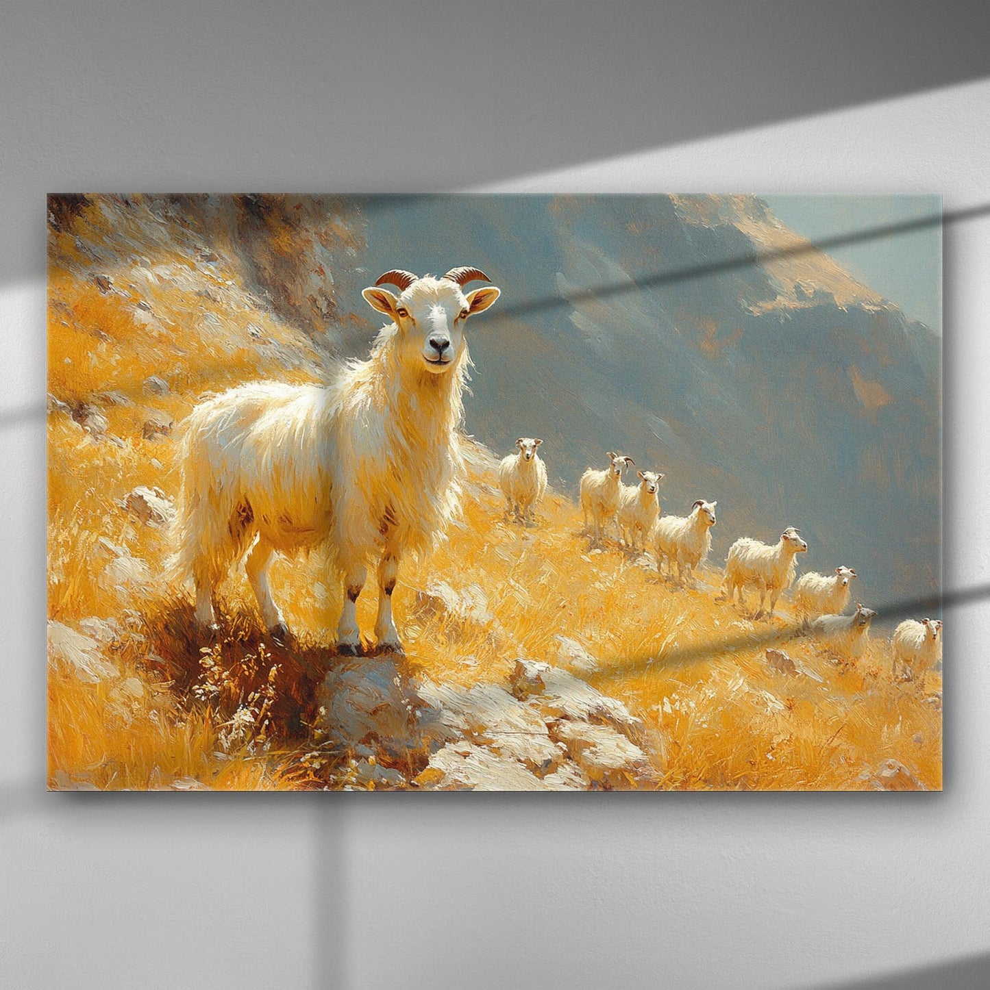A majestic mountain goat standing on a sunny slope with its herd in a golden landscape.